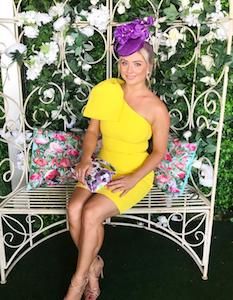 Customer wearing a yellow mini Rebecca Vallance race day dress.