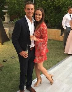 Customer with her friend wearing a red lace mini dress by Thurley